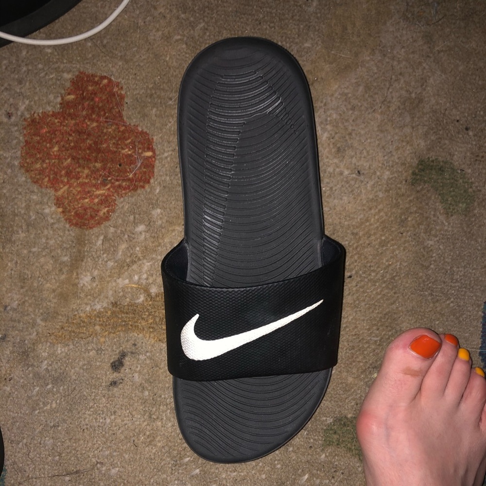 Black nike slides.